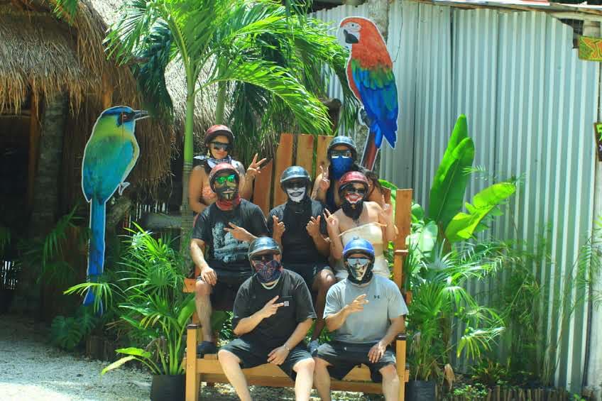 Group of visitors with colorful birds