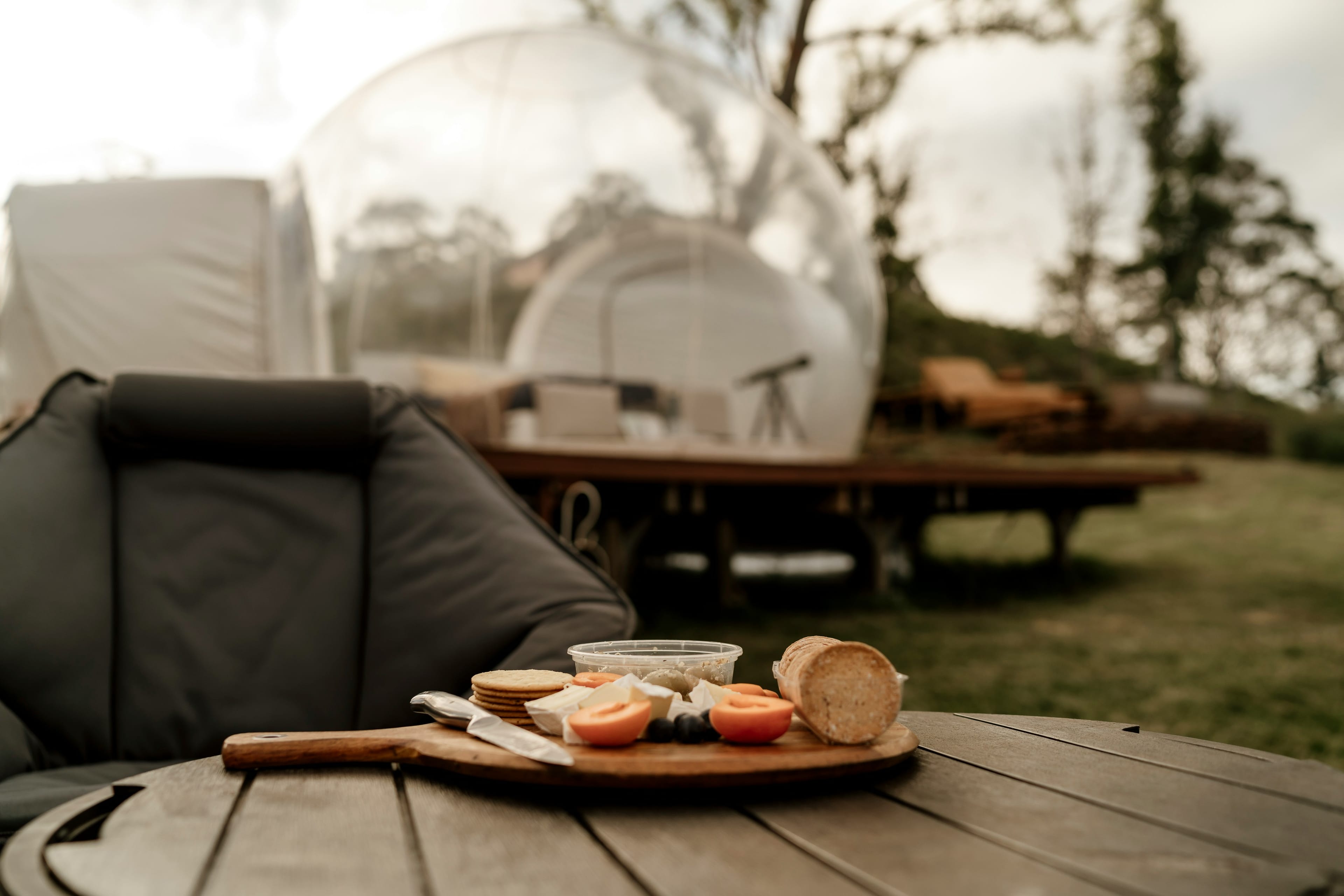 Elegant dining setup inside luxury geodesic dome with modern amenities